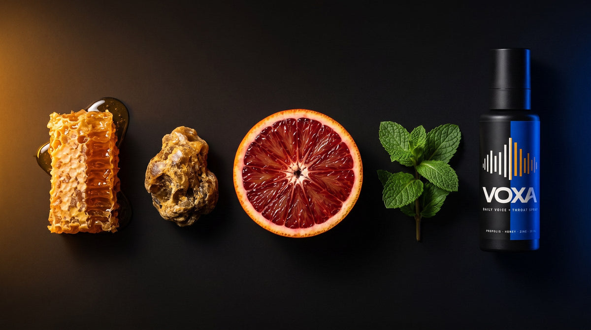 Honeycomb, bee propolis, blood orange and spearmint beside the VOXA bottle
